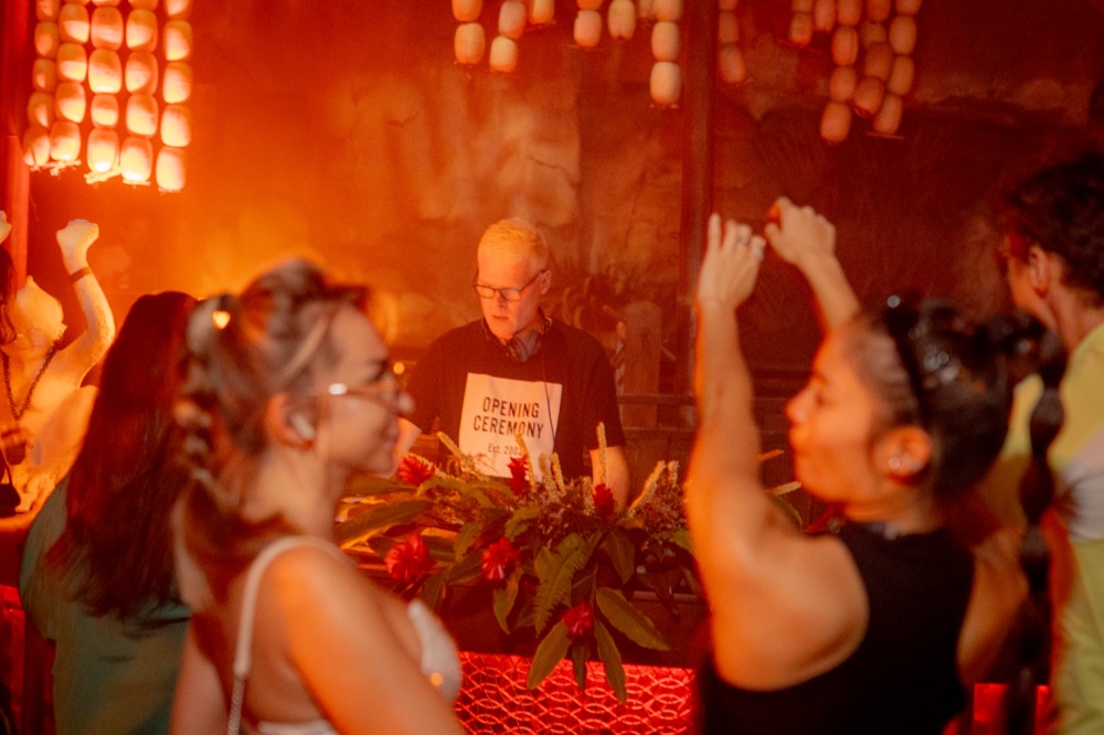 Crowd raising a toast at BABOU's opening ceremony