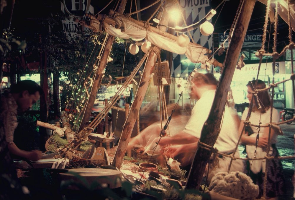 The seafood boat display lit at night with the team serving guests