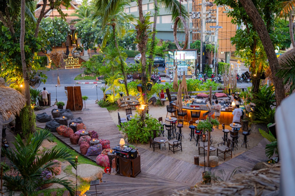 BABOU's Boat Bar, an open-air deck bar strung with lights among the palms